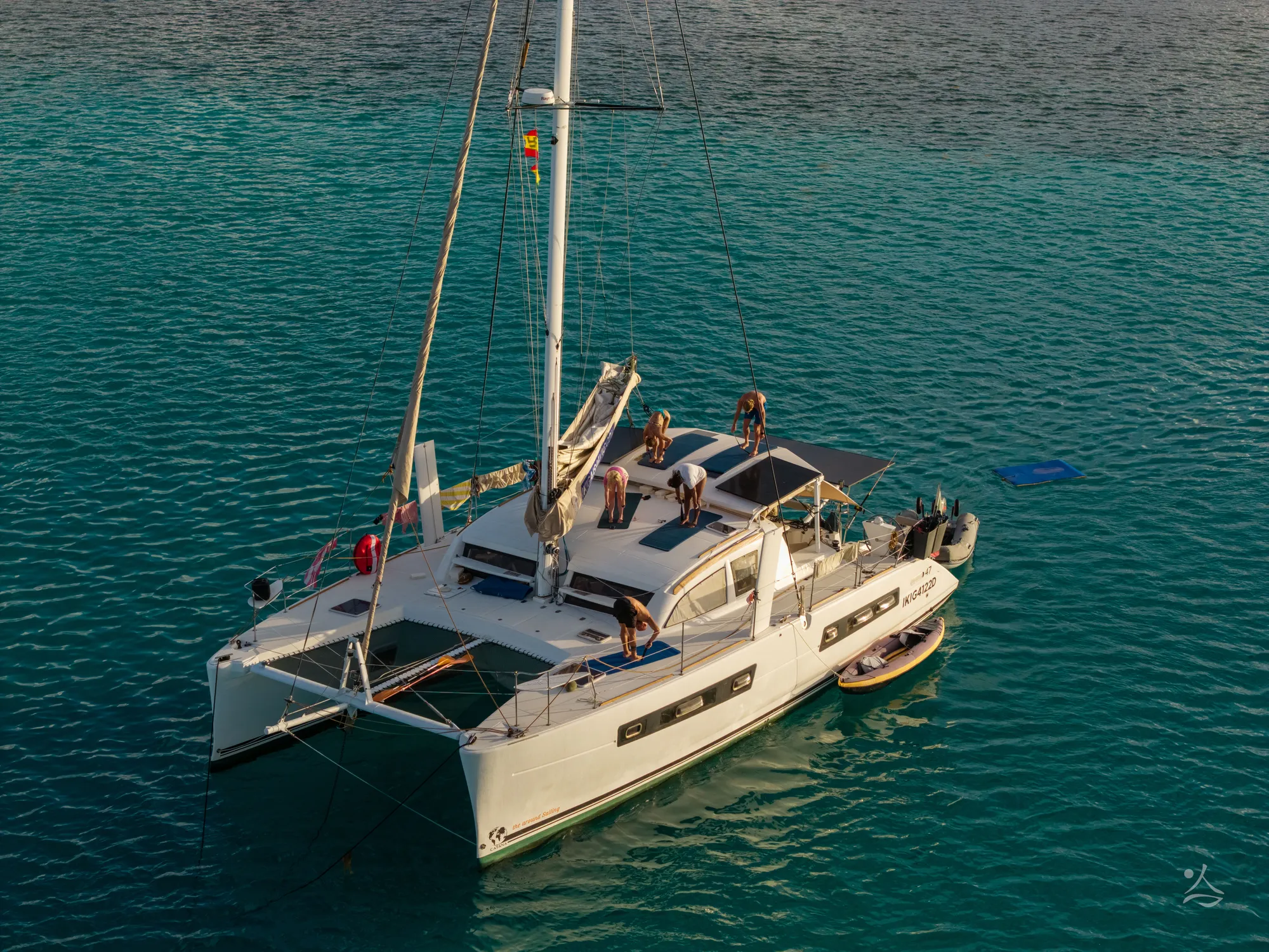 The catamaran Ikigai at anchor in turquoise water